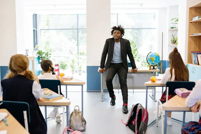 Educator speaking with a classroom of students